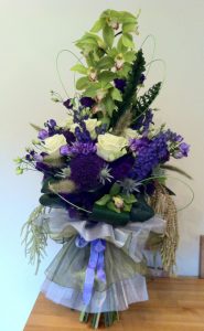 Purple green and white large bouquet with orchids and roses
