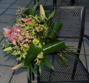 Large hand tied bouquet with pink orchids and stargazer lilies