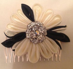 Black and white Kanzashi ribbon hair slide with diamonte centre.