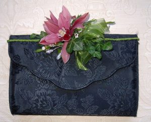 Pink cymbidium orchid handbag corsage