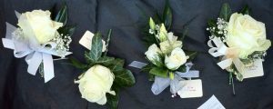 White rose and gyp corsage and buttonhole