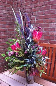 Large hand tied bouquet with ping protea