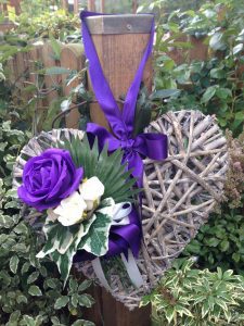 Woven willow heart with silk purple and white roses