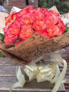 Handtied bouquet of coral roses