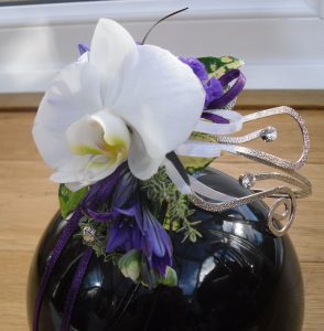White phalaenopsis and purple wrist corsage on diamonte bracelet