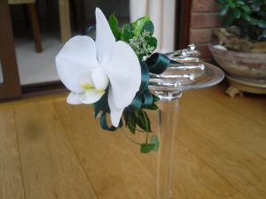 White phalaenopsis and ribbon arm corsage